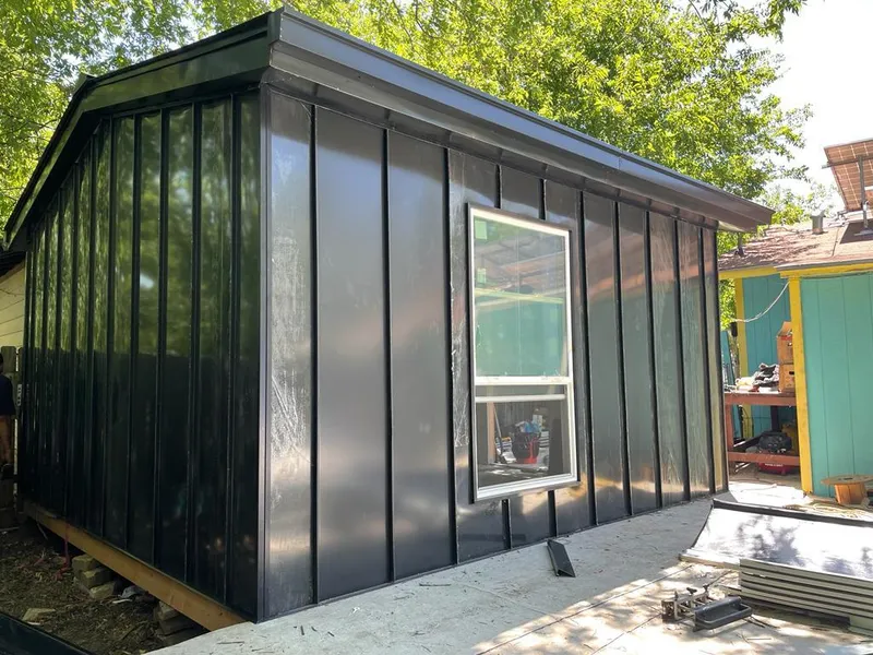 Black standing seam metal wall panels for Roof Inspection in Coralville